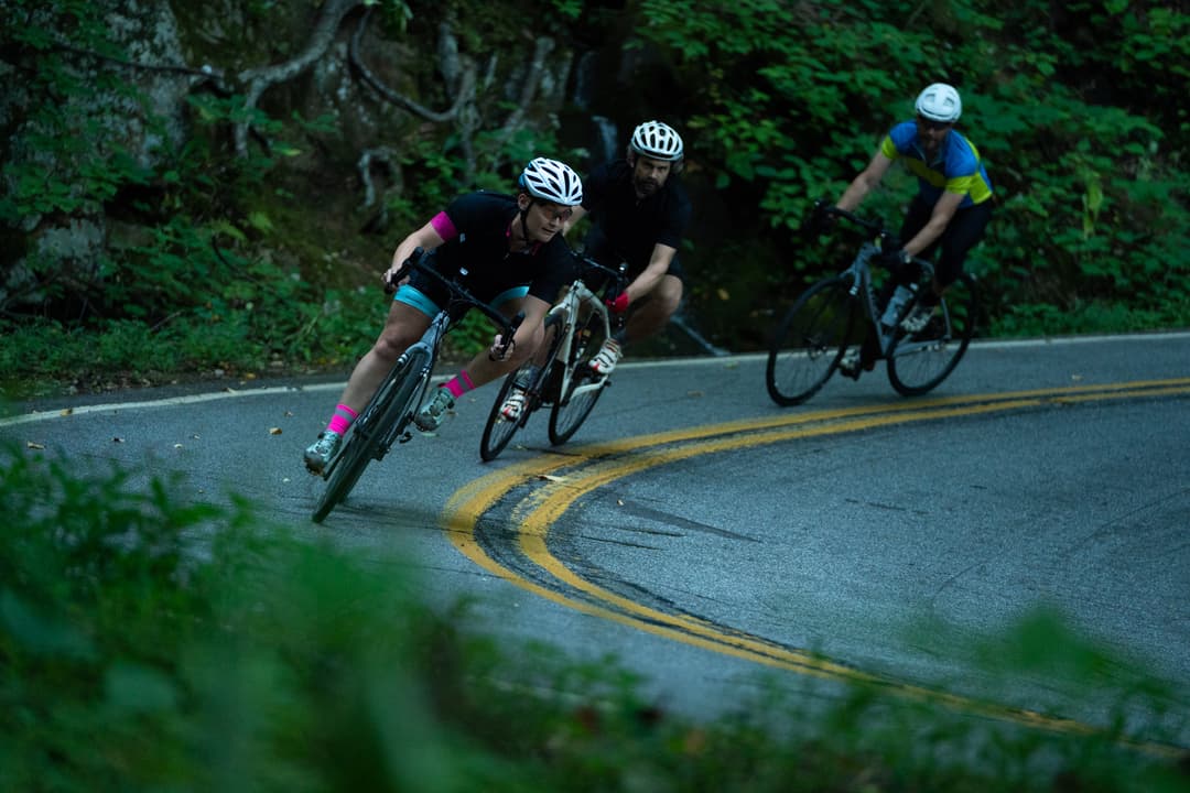 Cyclists making a sharp turn.